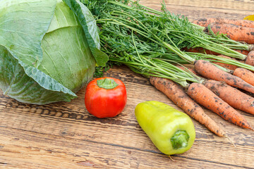 Carrots just picked in the garden on wooden boards