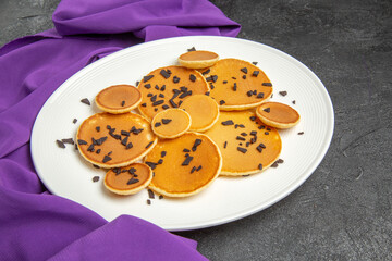 top view yummy little pancakes with choco chips on dark background dessert cake sweet