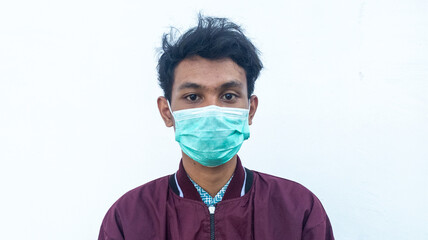 curly asian wearing mask in the middle of pandemic