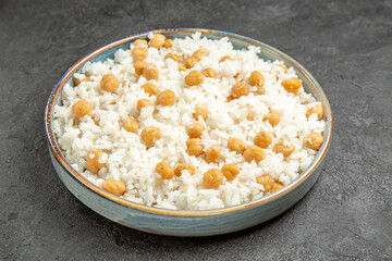 Close up view of easy-make ahead peas and rice meal for dinner on dark background