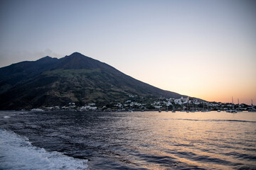 Lighthouse overlooking the sea, on an old inactive volcano, called Strombolicchio. The sunset...