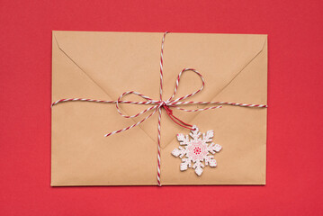 Top flatlay close up view photo of big package wrapped with striped rope and cute decor isolated bright background