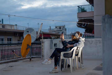 Young couple celebrating new years eve or st valentine's day on rooftop