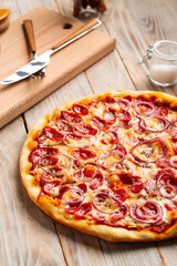 Closeup on hunter's sausage pizza on the wooden rustic table