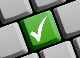 Lösung online - Häkchen Symbol auf grüner Computer Tastatur