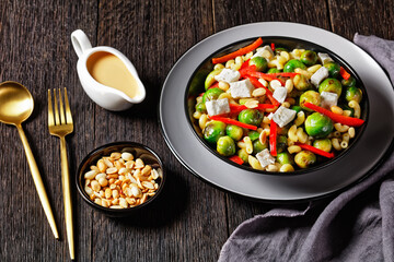 macaroni salad with broccoli sprouts in bowl