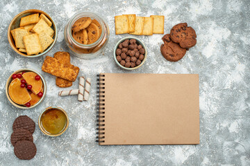 Close up view of breakfast time with chocolate cookies bisquits and honey on blue background