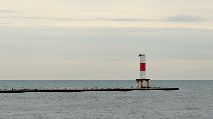 White lighthouse and seagulls