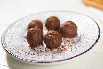 Chocolate ball cake with cocoa powder
