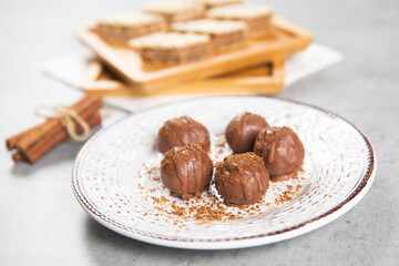 Chocolate ball cake with cocoa powder