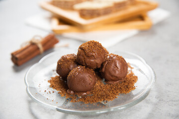 Chocolate ball cake with cocoa powder