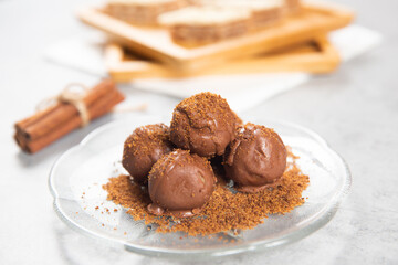 Chocolate ball cake with cocoa powder