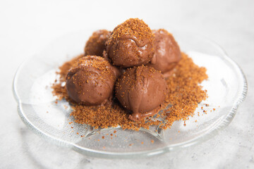 Chocolate ball cake with cocoa powder
