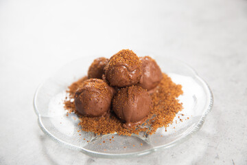 Chocolate ball cake with cocoa powder