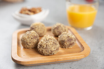 Cake balls with almonds, biscuits and orange juice