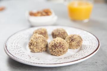 Cake balls with almonds, biscuits and orange juice