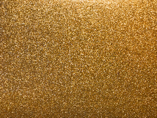 The texture is a sparkling golden dusty surface.