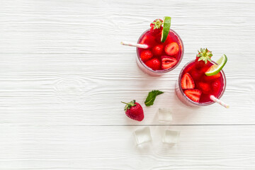 Fresh strawberry cocktail drink with ice, top view