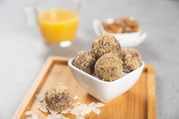 Cake balls with almonds, biscuits and orange juice