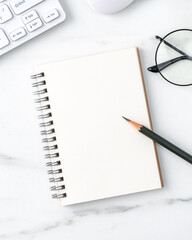 Top view of office table desk cozy work concept on bright marble white background.
