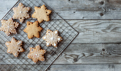 Horizontal top view copy space with Christmas homemade cookies and gingerbread at wood background