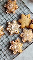 Close up Christmas cookies with glaze with snowflake shape at gray background