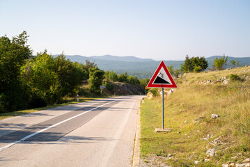 Downgrade sign at countryside road, Croatia.