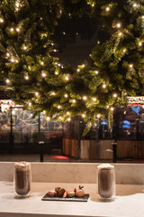 Fototapeta na wymiar Enjoy two cappuccino with christmas decoration looking through temple bar street