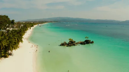 Wall murals Boracay White Beach White sand beach and Willy's rock with tourists and hotels and sailing boat on Boracay Island. Aerial drone: Tropical white beach with sailing boat. Summer and travel vacation concept.