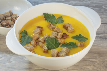 Traditional American pumpkin yellow soup.