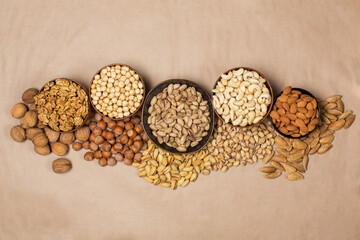 Different types of nuts in composition on white background in studio