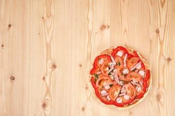 Unbaked pizza without cheese on a wooden board. Homemade food. Top view with copy space.