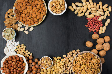 Different types of nuts in composition on white background in studio