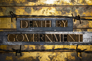 Death by Government text on vintage textured bronze grunge copper and gold background