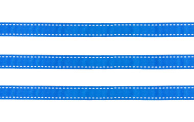 
Blue fabric ribbons with white dotted lines isolated on white background