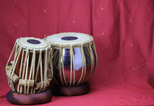 Indian tabla drums on a red background