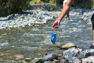 medical mask polluting nature's water