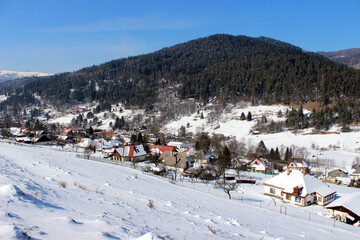Winter village with mountain scene