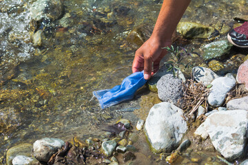 medical mask polluting nature's water