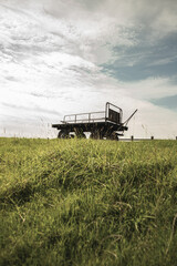 Naklejka premium A Rusty Trailer in a Field