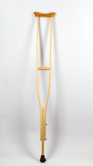 Wooden crutch on a white isolated background. Medical equipment
