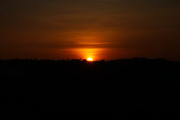 Sunset over the mountains in the evening