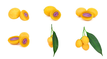 Plum Marian Set , Thai fruit is called Maprang or Mayongchid, cut in half, yellow orange, ripe, shadowed and without shadow, with green leaves. With purple seeds Isolated on a white background