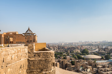Pavilion of Saladin Citadel of Cairo and Aerial view of Cairo of crowded buildings with dusty sky