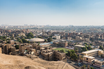 Fototapeta na wymiar Aerial view of Cairo of crowded buildings with dust sky from Saladin Citadel of Cairo