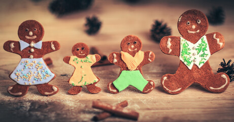 gingerbread men and cinnamon sticks on the Christmas table .