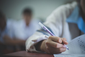 Student reading and taking exam with stress