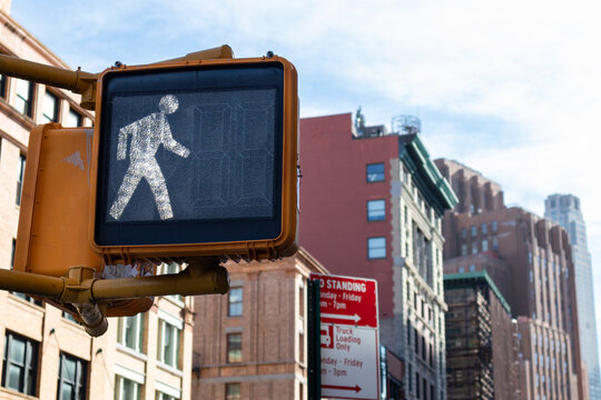 Walk Signal on a Street Light along a City Street in Tribeca of New York City
