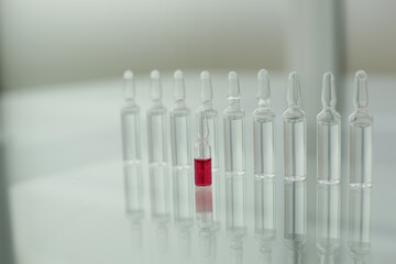 Glass ampoules on a glass table