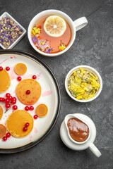 top view yummy pancakes with tea on grey desk fruit dessert sweet